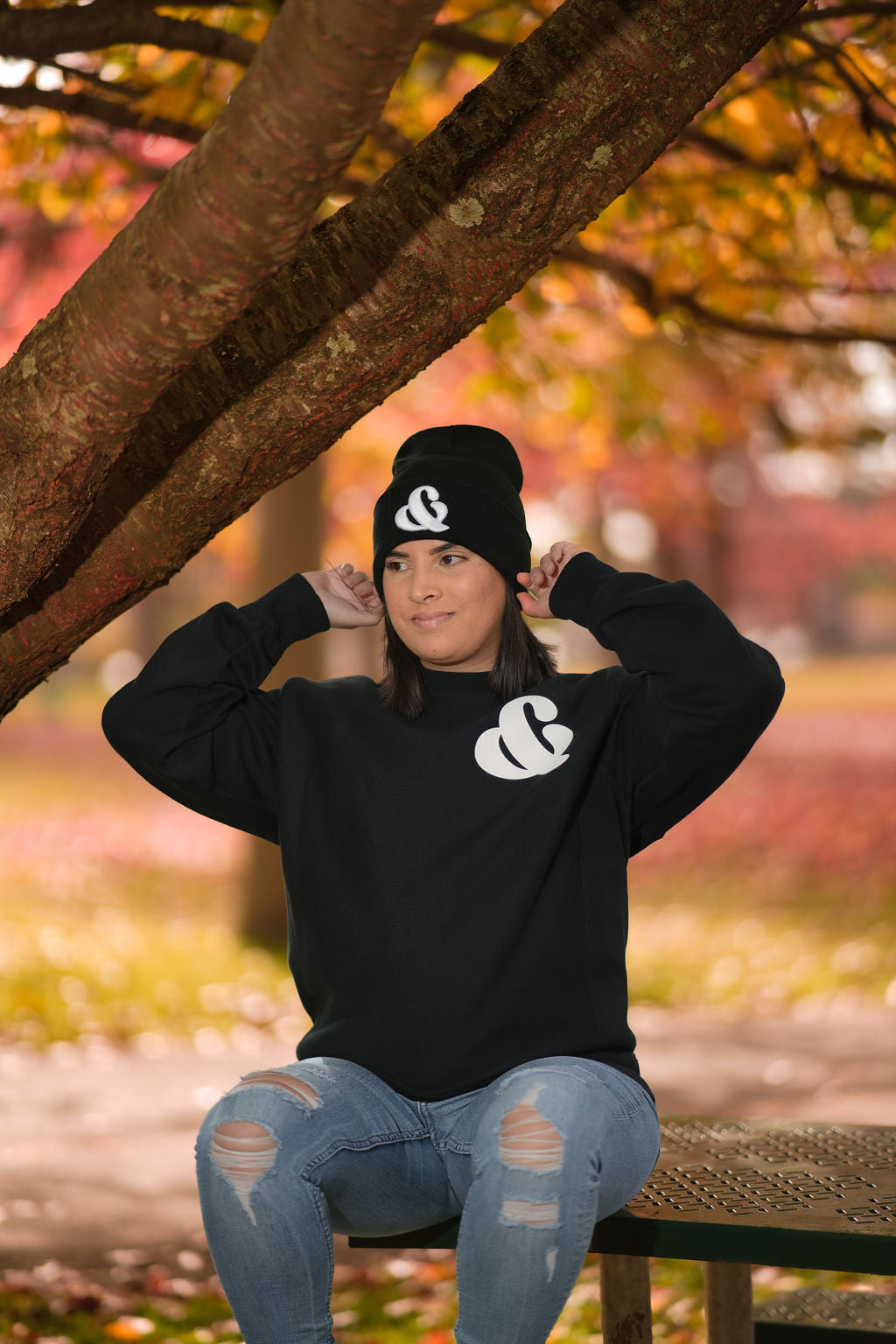 A girl wearing Ampersand (&) Beanie Embroidered Winter Hat